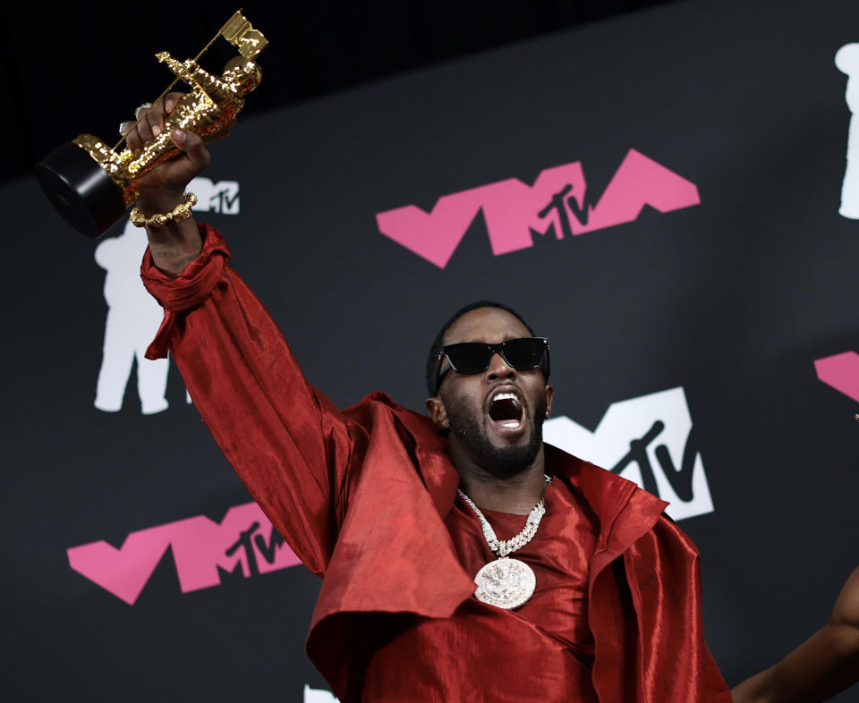 Diddy holds his Global Icon Award at the 2023 MTV Video Music Awards.