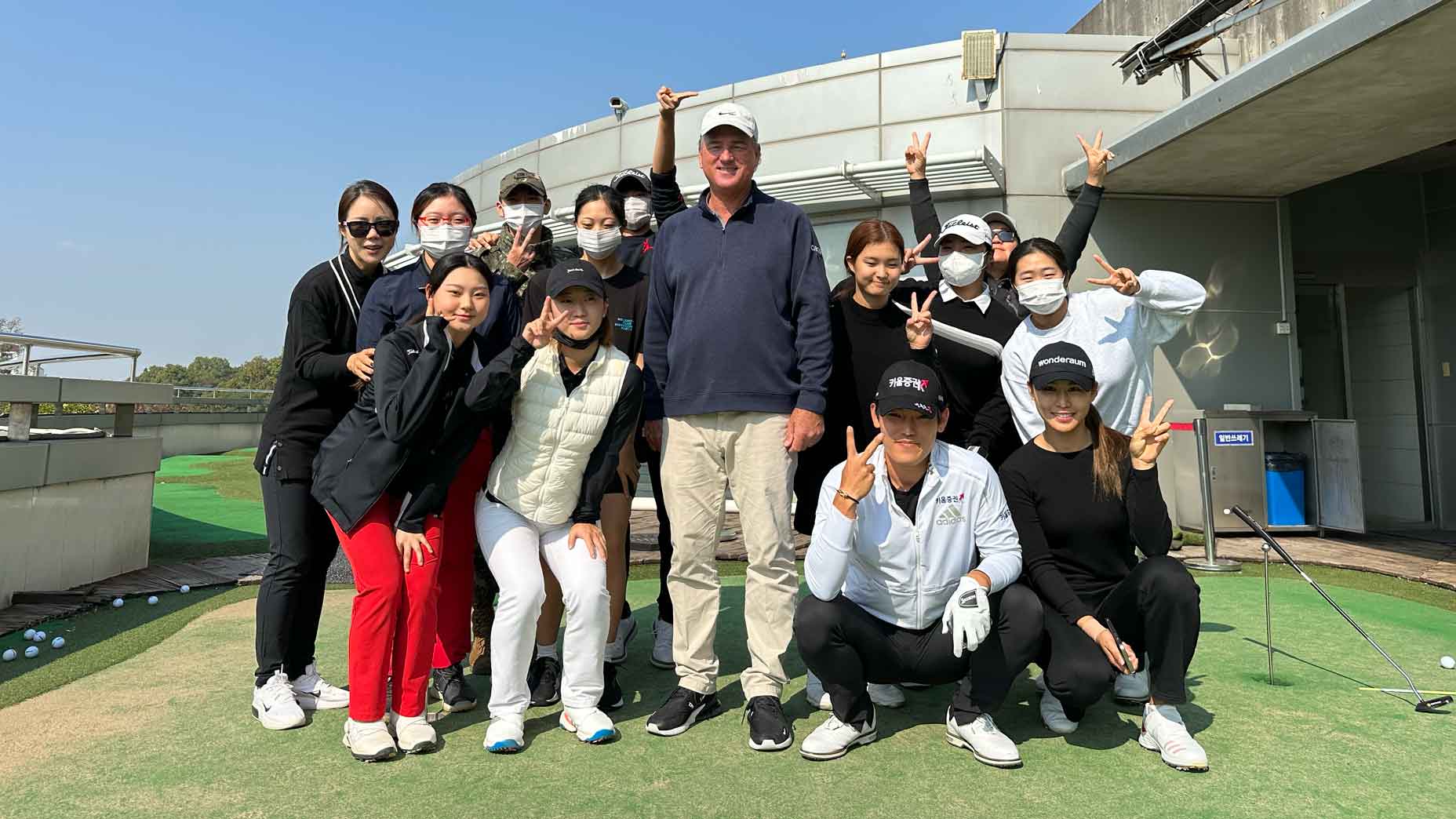 Top 100 GOLF teacher Brian Mogg and some of his South Korean instructors.